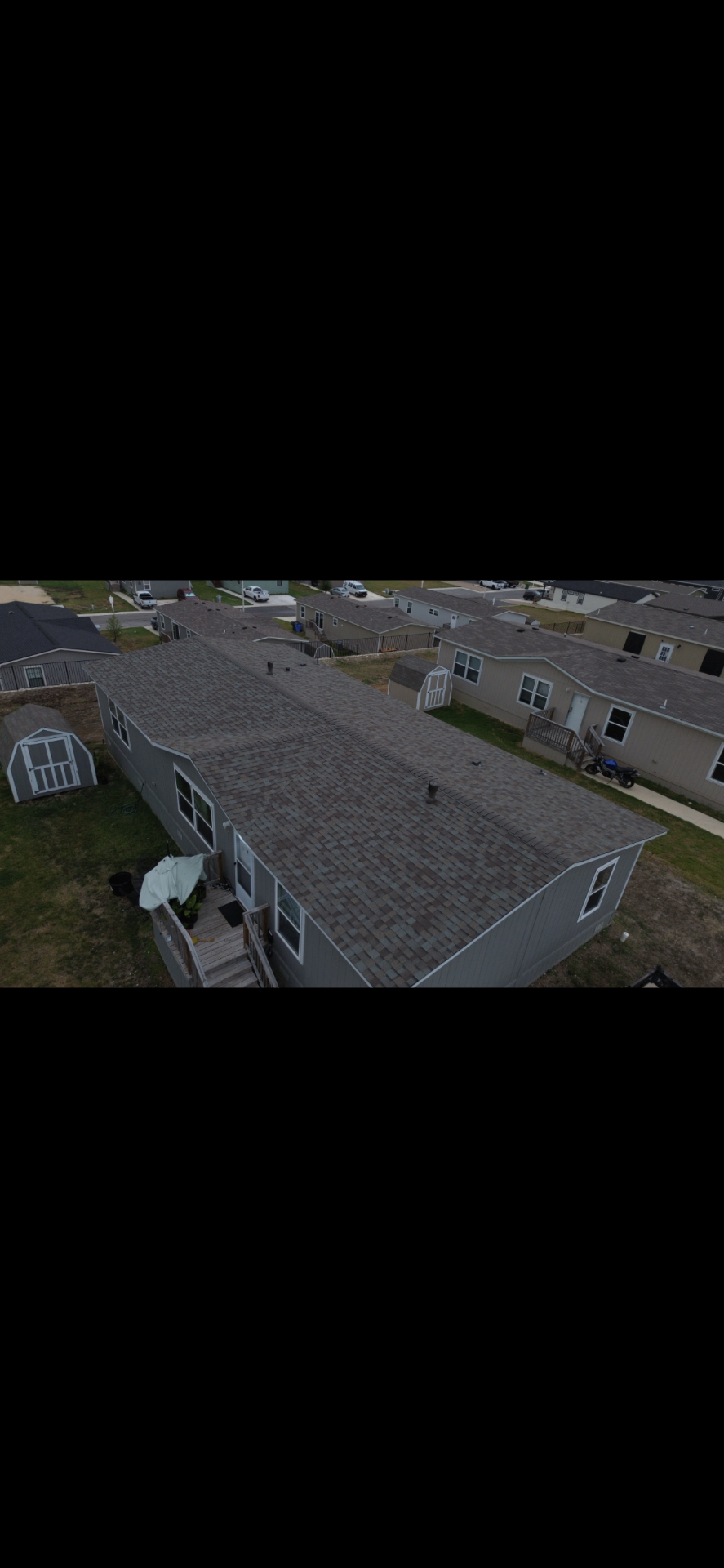 Aerial after photo of a Kyle, TX home with a brand-new architectural shingle roof installed by Tex-Mex Roofing.